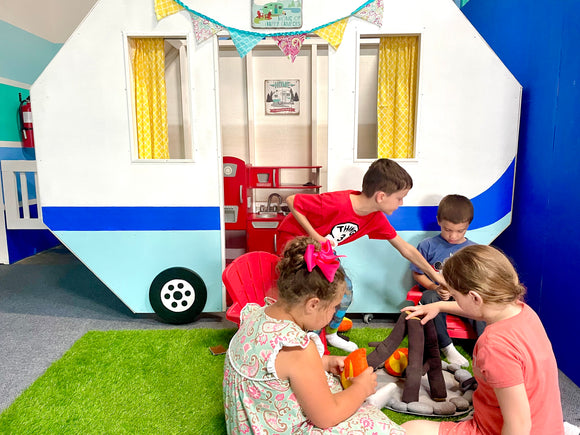 Children learn best through play with peers in real life situations. Gather around our pretend camper with a fire pit for building a fire and roasting marshmallows!